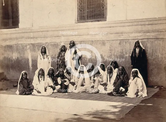 Kashmiri women in traditional dress: group portrait, c1900. Creator: Unknown.