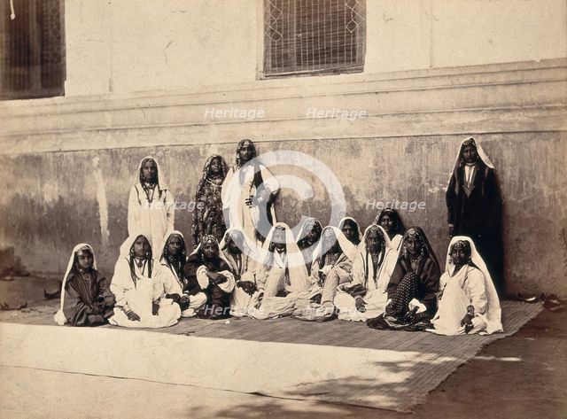 Kashmiri women in traditional dress: group portrait, c1900. Creator: Unknown.