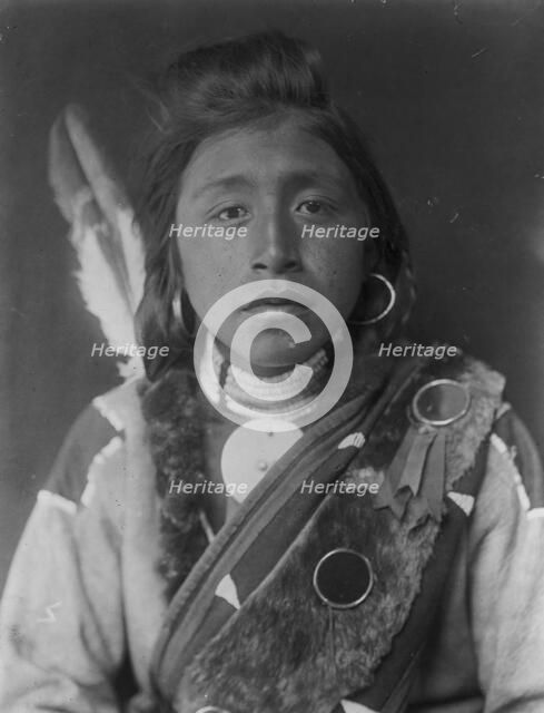 Kashhila-Wishham. Male Chinookan Indian, head-and-shoulders portrait, facing front..., c1910. Creator: Edward Sheriff Curtis.