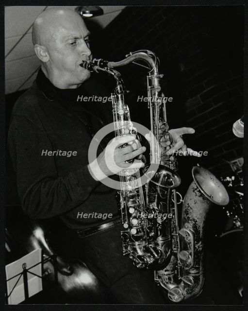 Kelvin Christiane playing two saxophones at The Fairway, Welwyn Garden City, Hertfordshire, 2002. Creator: Denis Williams.