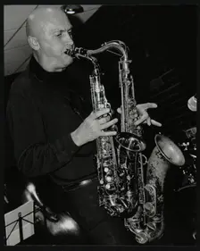 Kelvin Christiane playing two saxophones at The Fairway, Welwyn Garden City, Hertfordshire, 2002. Creator: Denis Williams