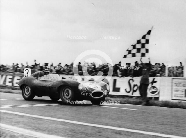 Ken Wharton in a Jaguar D Type, Rheims 12 Hours Race, France, 3rd July 1954. Artist: Unknown