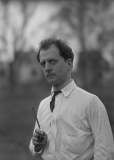 Kennerley, Mitchell, Mr., standing outdoors, 1914 or 1915. Creator: Arnold Genthe