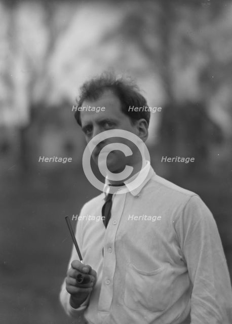 Kennerley, Mitchell, Mr., standing outdoors, 1914 or 1915. Creator: Arnold Genthe.