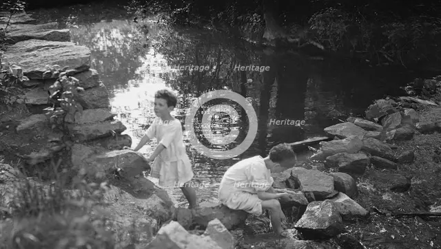 Kennerley, Richard and Morley, playing by a pond, 1912 or 1913. Creator: Arnold Genthe.