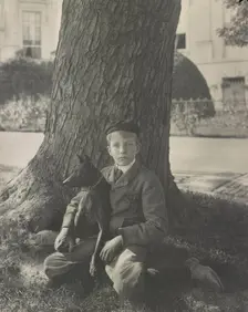 Kermit Roosevelt and his dog Jack, 1902. Creator: Frances Benjamin Johnston