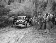 KHL Seaton's Ford Model A saloon receiving a push in the Inter-Varsity Trial, 1930. Artist: Bill Brunell