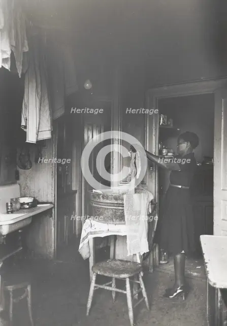 Kitchen of apartment occupied by Negroes, South Side of Chicago, Illinois, April 1941. Creators: Farm Security Administration, Russell Lee.