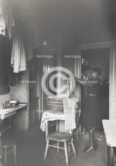 Kitchen of apartment occupied by Negroes, South Side of Chicago, Illinois, April 1941. Creators: Farm Security Administration, Russell Lee.