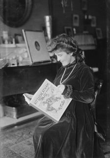 Kitty Cheatham [with her book], 1916. Creator: Bain News Service