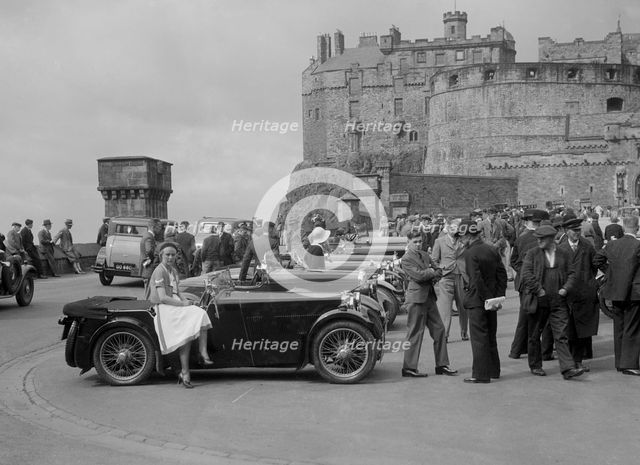 Kitty Brunell and her MG Magna on Castle Esplanade, Edinburgh, RSAC Scottish Rally, 1932. Artist: Bill Brunell.