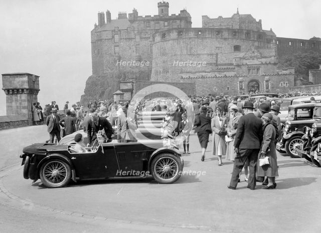 Kitty Brunell and her MG Magna on Castle Esplanade, Edinburgh, RSAC Scottish Rally, 1932. Artist: Bill Brunell.