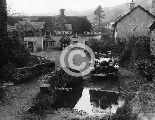 Kitty Brunell at the wheel of a Ford Model A, Winsford, Somerset, 1930. Artist: Unknown