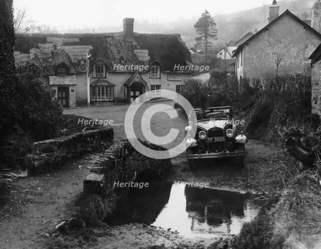 Kitty Brunell at the wheel of a Ford Model A, Winsford, Somerset, 1930. Artist: Unknown