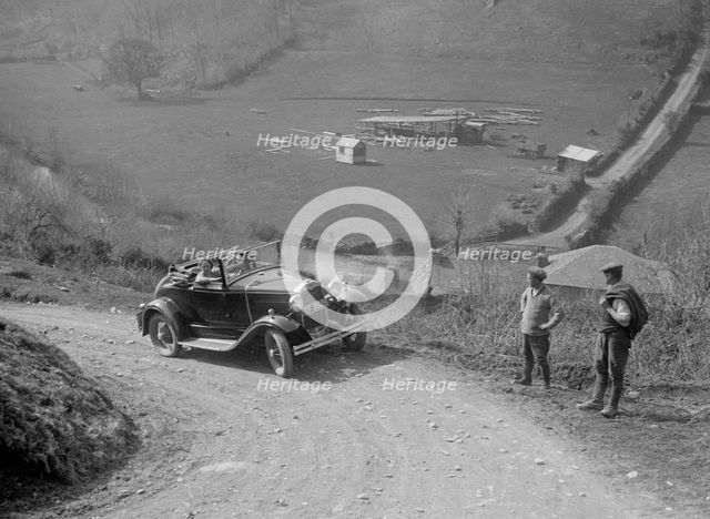 Kitty Brunell driving a 1930 2-seater Ford Model A, 1931.   Artist: Bill Brunell.