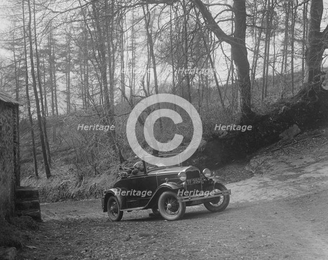 Kitty Brunell driving a 1930 2-seater Ford Model A, 1931.   Artist: Bill Brunell.