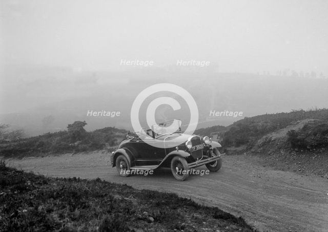 Kitty Brunell driving a 1930 2-seater Ford Model A, 1931.   Artist: Bill Brunell.