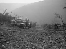 Kitty Brunell driving a 1930 2-seater Ford Model A, 1931. Artist: Bill Brunell