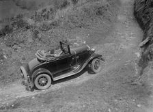 Kitty Brunell driving a 1930 2-seater Ford Model A, 1931. Artist: Bill Brunell
