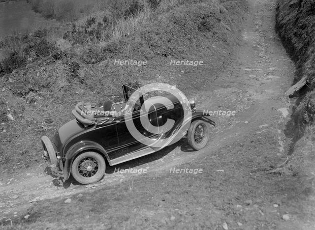 Kitty Brunell driving a 1930 2-seater Ford Model A, 1931.   Artist: Bill Brunell.