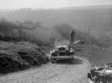 Kitty Brunell driving a 1930 2-seater Ford Model A, 1931. Artist: Bill Brunell