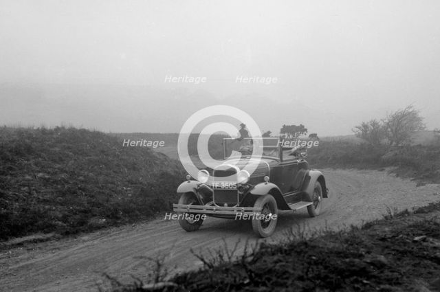 Kitty Brunell driving a 1930 2-seater Ford Model A, 1931.   Artist: Bill Brunell.
