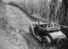 Kitty Brunell driving a 1930 Ford Model A 2-seater, 1931. Artist: Bill Brunell