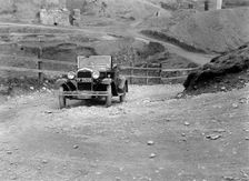 Kitty Brunell driving a 1930 Ford Model A 2-seater, 1931. Artist: Bill Brunell