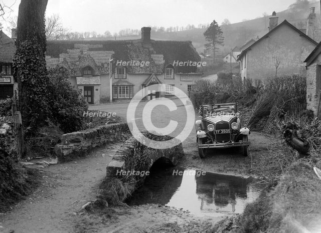 Kitty Brunell driving a Ford Model A 2-seater, Winsford, Somerset, 1930s. Artist: Bill Brunell.