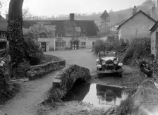Kitty Brunell driving a Ford Model A 2-seater, Winsford, Somerset, 1930s. Artist: Bill Brunell