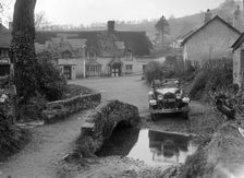 Kitty Brunell driving a Ford Model A 2-seater, Winsford, Somerset, 1930s. Artist: Bill Brunell