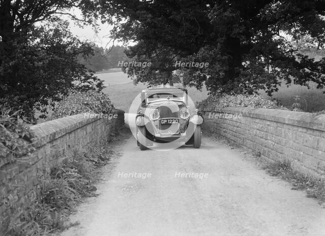 Kitty Brunell road testing a 1931 Delage D8. Artist: Bill Brunell.