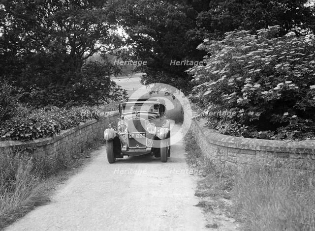 Kitty Brunell road testing a 1931 Delage D8. Artist: Bill Brunell.