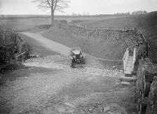 Kitty Brunell road testing a MG 18/80, Tan Hill, Yorkshire, April 1931. Artist: Bill Brunell