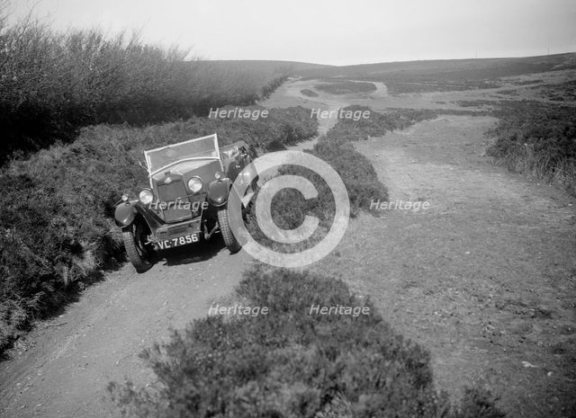 Kitty Brunell road testing a Riley 9 tourer, c1930.  Artist: Bill Brunell.
