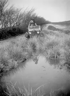 Kitty Brunell road testing a Riley 9 WD tourer, c1930. Artist: Bill Brunell