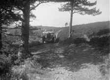 Kitty Brunell road testing a Riley 9 WD tourer, c1930. Artist: Bill Brunell