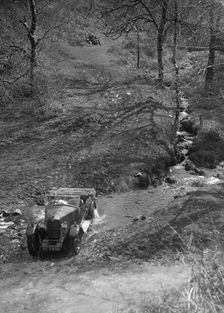 Kitty Brunell road testing a Riley 9 WD tourer, c1930. Artist: Bill Brunell