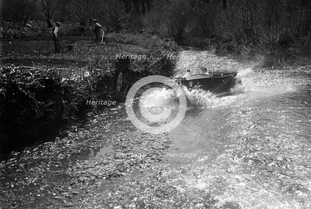 Kitty Brunell road testing a Riley 9 WD tourer, c1930. Artist: Bill Brunell.