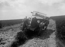 Kitty Brunell road testing a Riley 9 WD tourer, c1930. Artist: Bill Brunell