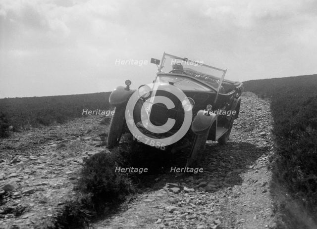 Kitty Brunell road testing a Riley 9 WD tourer, c1930. Artist: Bill Brunell.