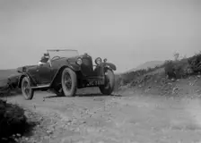 Kitty Brunell road testing a Riley 9 WD tourer, c1930. Artist: Bill Brunell