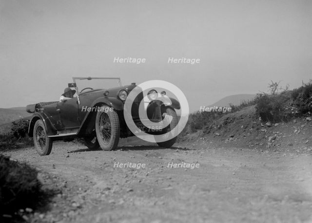 Kitty Brunell road testing a Riley 9 WD tourer, c1930. Artist: Bill Brunell.