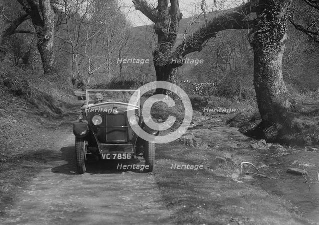 Kitty Brunell road testing a Riley 9 WD tourer, c1930. Artist: Bill Brunell.