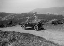 Kitty Brunell road testing a Riley 9 WD tourer, c1930. Artist: Bill Brunell