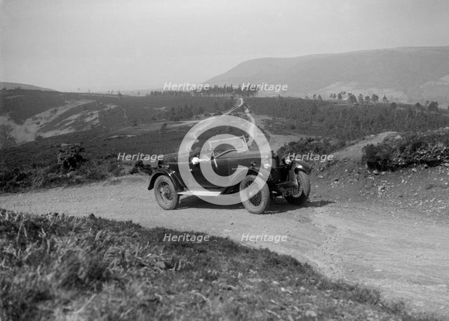 Kitty Brunell road testing a Riley 9 WD tourer, c1930. Artist: Bill Brunell.