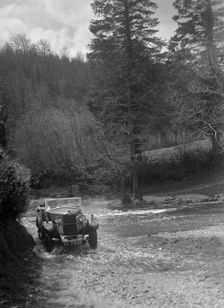 Kitty Brunell road testing a Riley 9 WD tourer, c1930. Artist: Bill Brunell