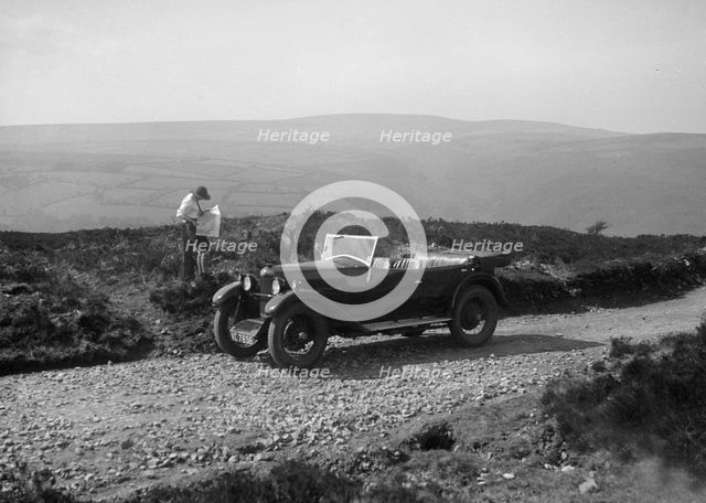 Kitty Brunell road testing a Riley 9 WD tourer, c1930. Artist: Bill Brunell.