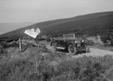 Kitty Brunell road testing a Riley 9 WD tourer, c1930. Artist: Bill Brunell