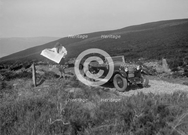 Kitty Brunell road testing a Riley 9 WD tourer, c1930. Artist: Bill Brunell.
